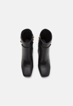 TWINSET Tronchetto Con Plateau E Catena Oval - Bottines À Plateau - Nero -Magasin Général De Mode 1e087b0a96144cecb97268ad1d897bd4