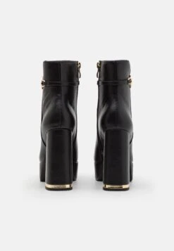 TWINSET Tronchetto Con Plateau E Catena Oval - Bottines À Plateau - Nero -Magasin Général De Mode 335e614110ea4980a4b704e43bf637e2